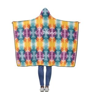 A colourful Core Guide hooded blanket featuring the affirmation “I Shine,” worn as a warm, uplifting reminder of confidence and personal motivation.