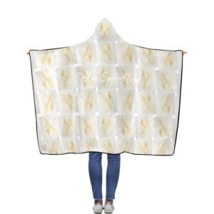 A person stands with their back to the camera wearing a hooded blanket printed with soft golden abstract shapes on a pale background. Across the upper back, the phrase “I Am Safe Here” appears in gentle script. A small QR code and the words “Core Guide” sit quietly in the lower left corner, creating a discreet portal to a private audio experience.